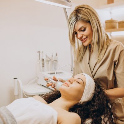 Woman at cosmetologist making beauty procedures